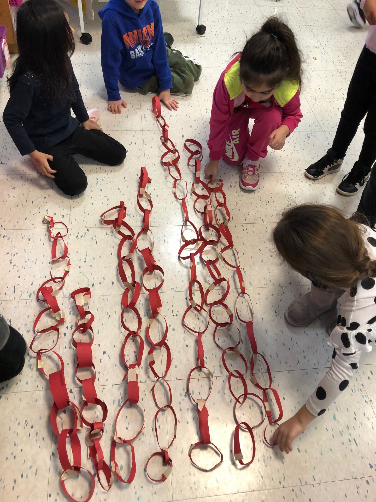 Students doing a paper chain challenge